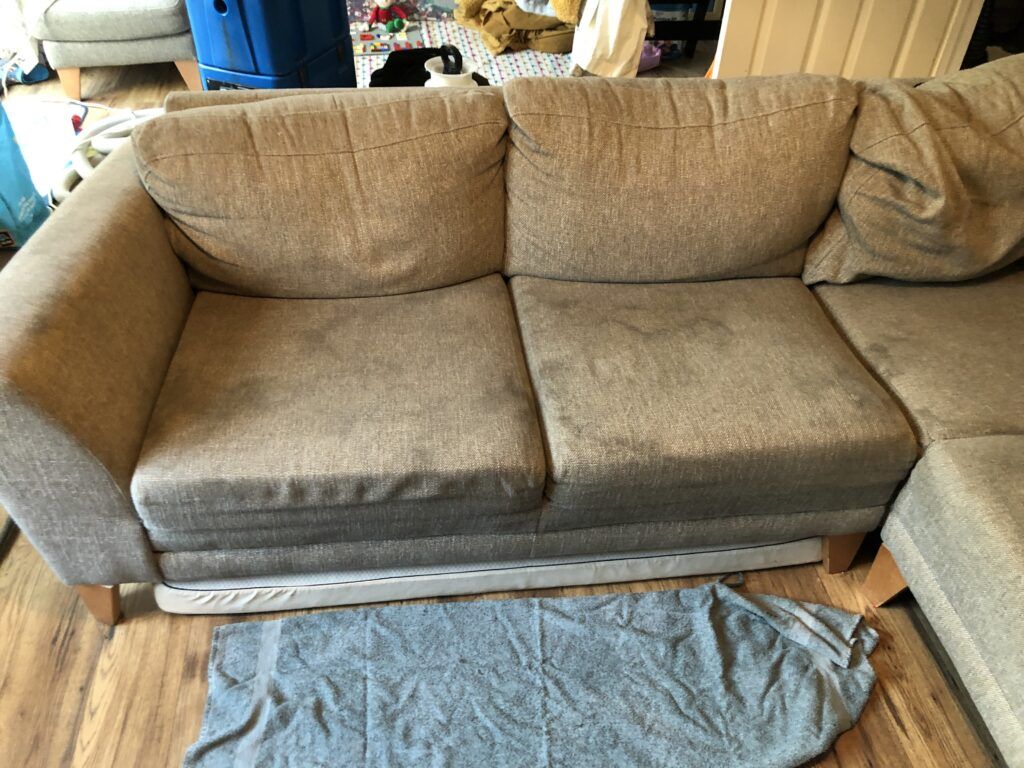 Dirty stained sofa before cleaning